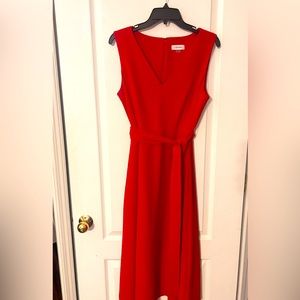 Red Calvin Klein dress.  Material is Polyester and Spandex.